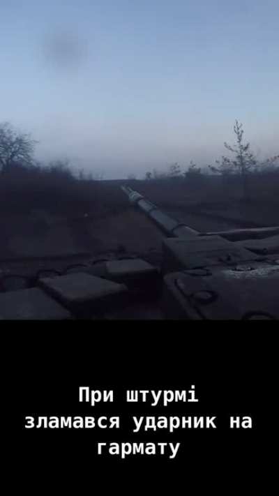A Ukrainian tank is narrowly missed by a Russian anti-tank rocket