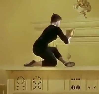 Leslie Caron reading a book in the movie, "An American in Paris", 1951