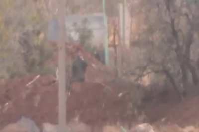 Syrian Army soldier out for a cigarette is engaged by an Opposition sniper - Busra al-Sham - 2013