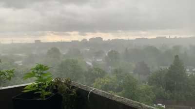 Sheets of rain off my balcony garden.