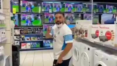 An Olympique fan (PSG archrival), angry at the arrival of Messi to PSG, smashes televisions at a local store in France.