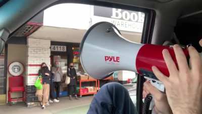 bicyclist doesn't like lockdown protest