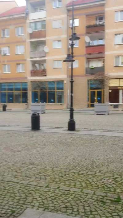 BOOM! And with just such a decisive step I walk out into the old town square. And my big boobs along with me. Heh