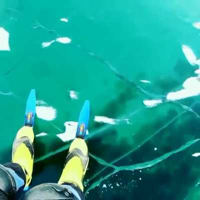Alien-like chatter of the world&rsquo;s deepest lake as photographer shares eerie sounds of newly-formed ice. Alexey Kolganov films himself skating on transparent ice of lake Baikal, as new cracks form under his skates