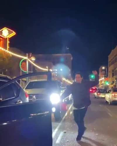 Native American gets out of car and breaks out into dance in the middle of the street in Albuquerque NM