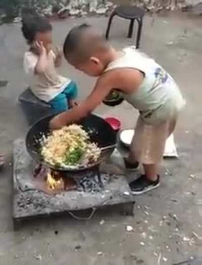 Big brother makes meal for lil brother and feeds him himself