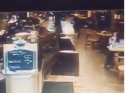 Kid tries to steal a tip jar
