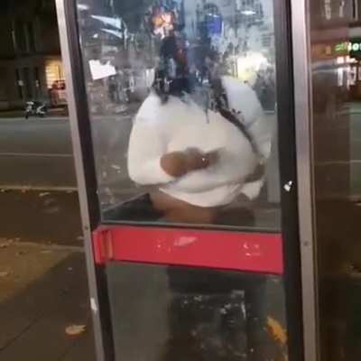 Shitting in a phone booth