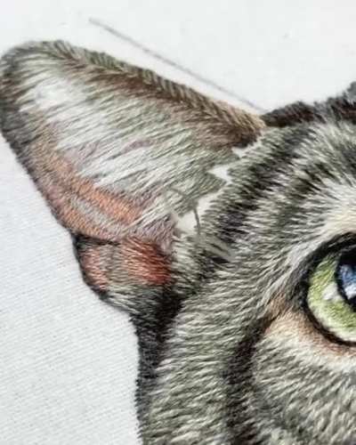 This tabby cat embroidery took 50+ hours and thousands of tiny stitches