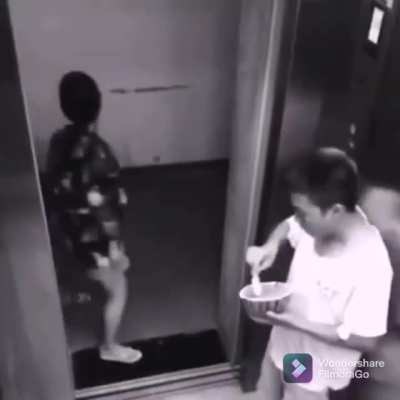 Guy enjoying half a watermelon