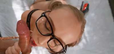 Blowjob by cute woman in glasses