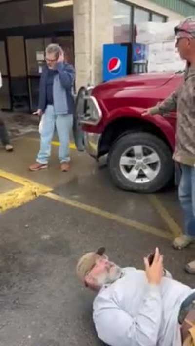 Old guys fight over bad parking, one throws a punch the other shoots him. 