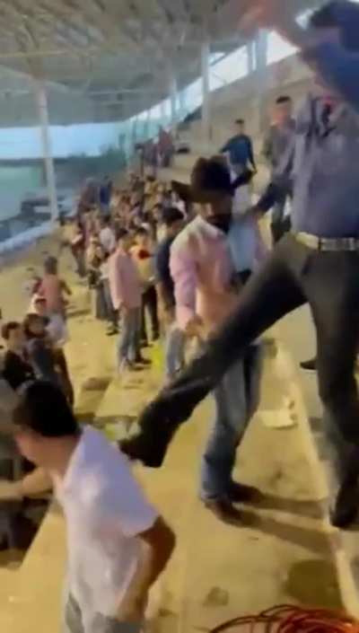 Kicking a guy down the steps.