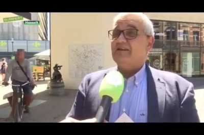 Drunk guy runs into an interview in Belgium