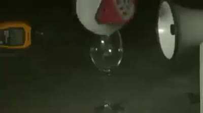 Breaking a glass with a megaphone.