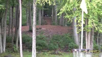 Disc golfer (Kevin Jones) slips on the teepad but still manages to get an ace on 530ft hole