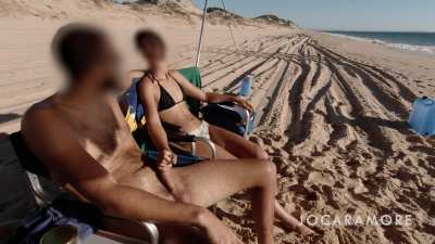 Getting a handjob by my stunning wife on the beach!