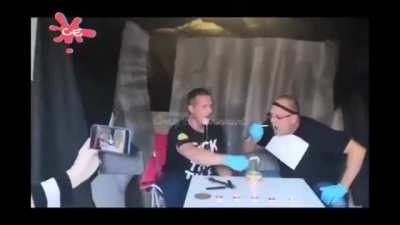 2 guys eating Surstr&ouml;mming