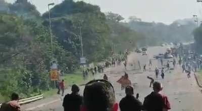 Private security and citizens opening fire on rioters in Durban, South Africa.
