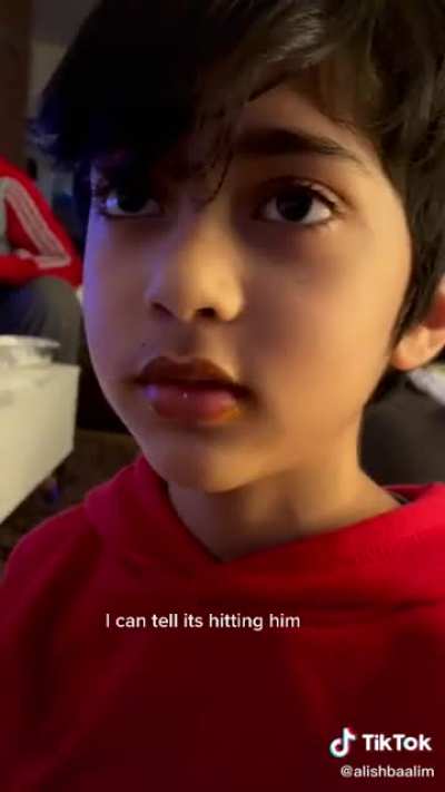 Kid tries spicy wings