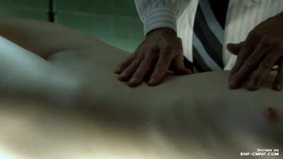 CMNF girl lying on table completely naked exposing her shaved pussy