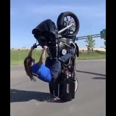 That&rsquo;s a big bike to get up one wheel. Big idiot to do it on a public road with no helmet, too.