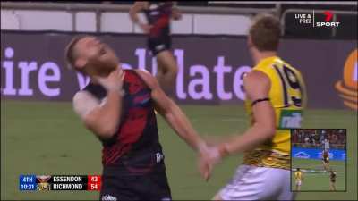 Tom Lynch hits Hurley in the throat behind the play