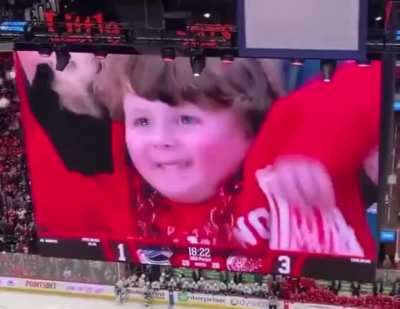 Fans at a hockey game cheered every time this 4 yr old boy was shown on the big screen