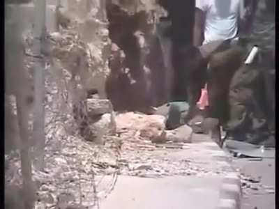 Israeli soldiers shoot a Palestinian captive who was already blindfolded and handcuffed