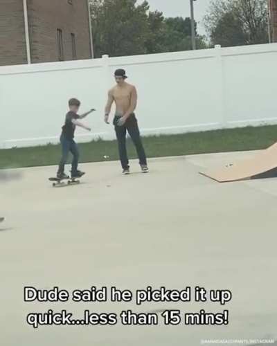 Big skate dude teaches little skate dude