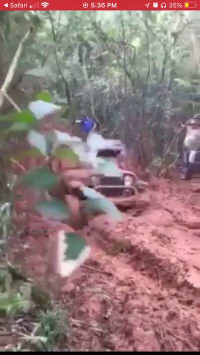 Chain snaps while towing vehicle out of mud, tearing drivers jaw off. He shouldn't have been sitting there