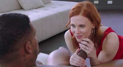 Cute redhead gives clothed blowjob