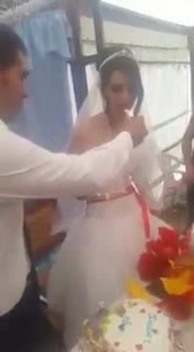 The guy probably saw a mosquito on her hand.