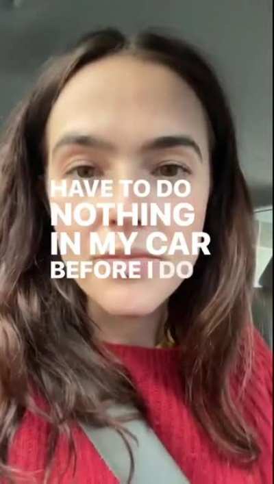 Sitting in her car