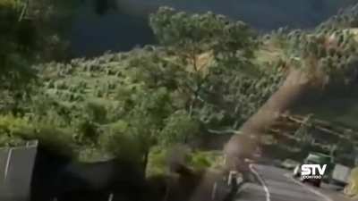 Driver tries to overtake row of cars and meets a tractor trailer