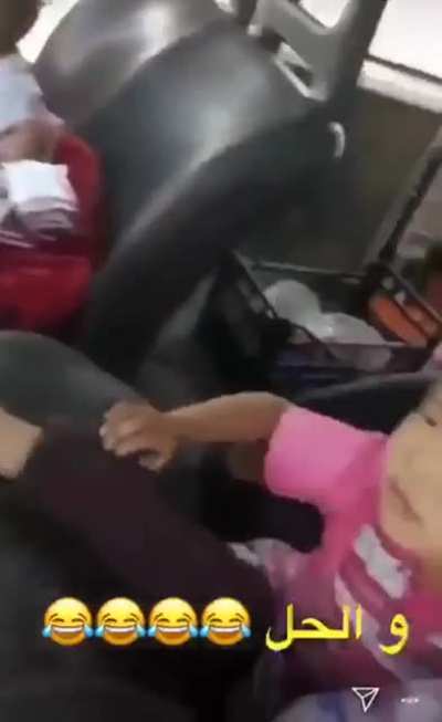 Head stuck inside steering wheel.