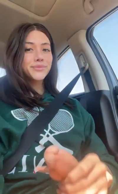 Playing with her racquet.