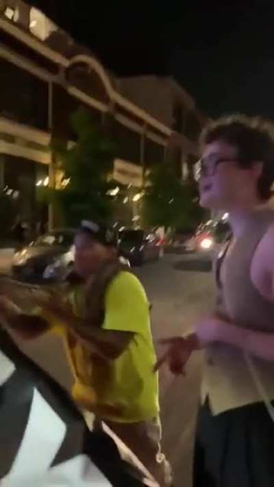 Religious protester in Seatle doesn't like snakes.