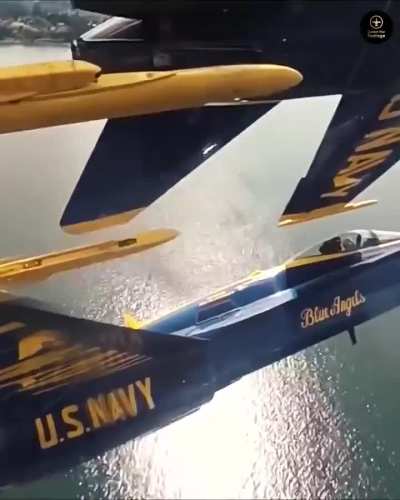 Cockpit view from US Navy F-18 Blue Angels as they fly in formation.