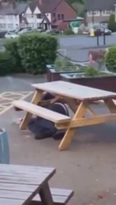 Angry drunk guy tries to flip a table