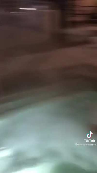 Two dudes chilling in a hot tub