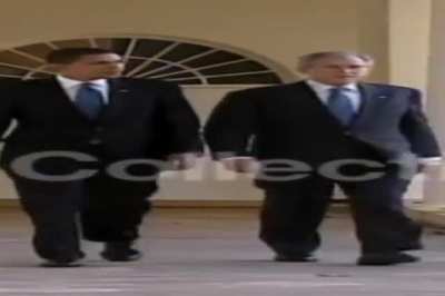 Wide Obama and Wide Bush walking