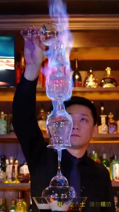 A full-on flaming cocktail tower