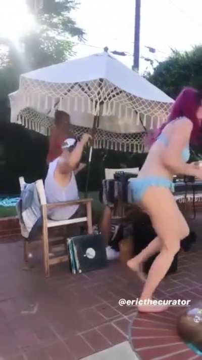 Shaking her assets
