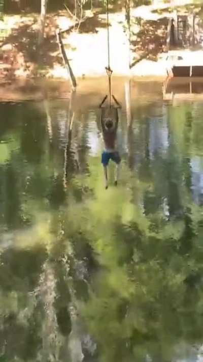 My little brother backfloping on a rope swing