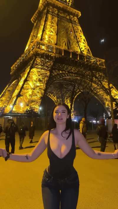 Emily shaking them at the Eiffel Tower