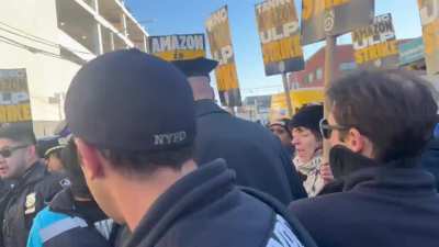 Workers demanded the cops release the arrested Amazon driver, shouting, “Let him Go!”