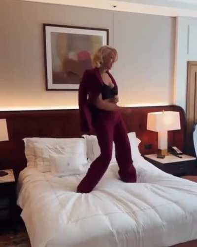 Hannah Waddingham dancing on the bed for The Sunday Times Magazine, 2025