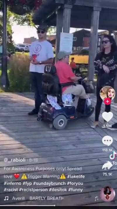Racist on a scooter being awful