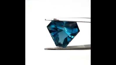 More "Fun with Shapes" London Blue Topaz 13.76ct 14.28mm. Brazil rough and like nearly all blue Topaz it's irradiated. I cut this in the "Lucifer" design which really does bring the light :-) Sub price $645 USD plus shipping.